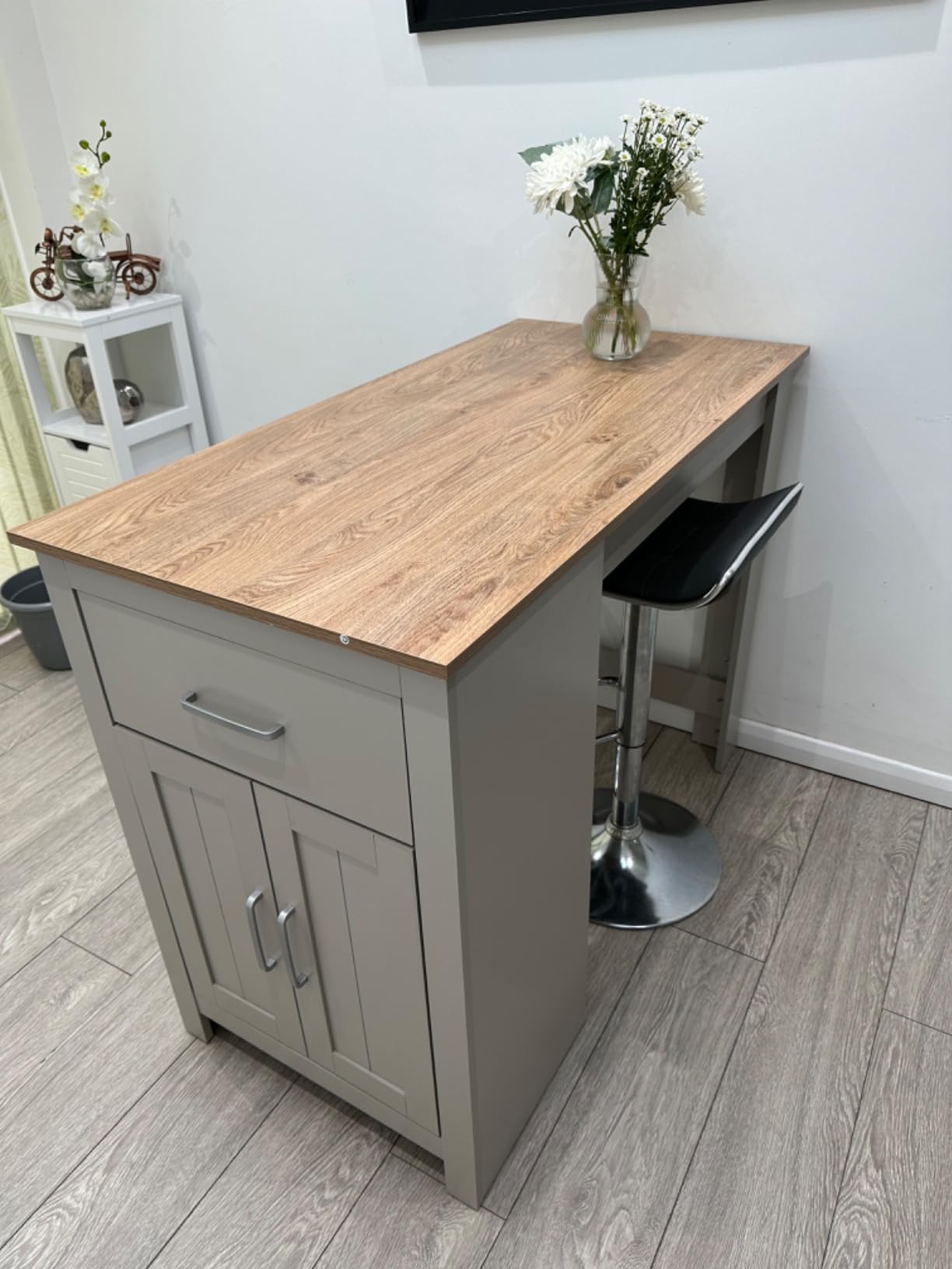 wooden grey kitchen island with storage cabinet and drawer