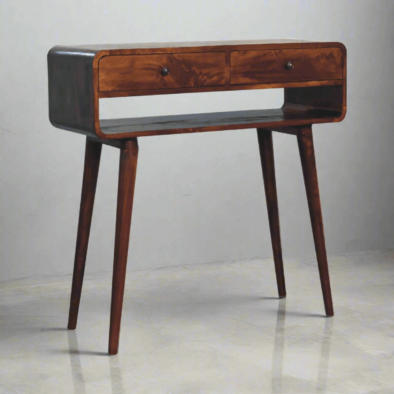a curved console table in dark wood tone