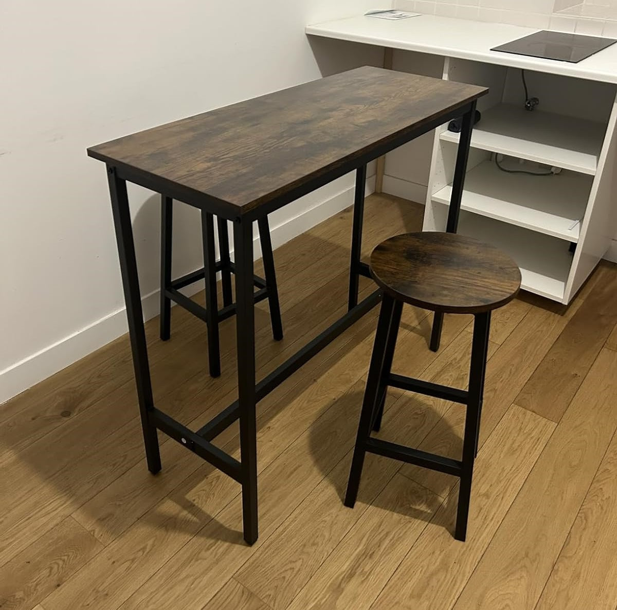 breakfast bar table with two stools in industrial style