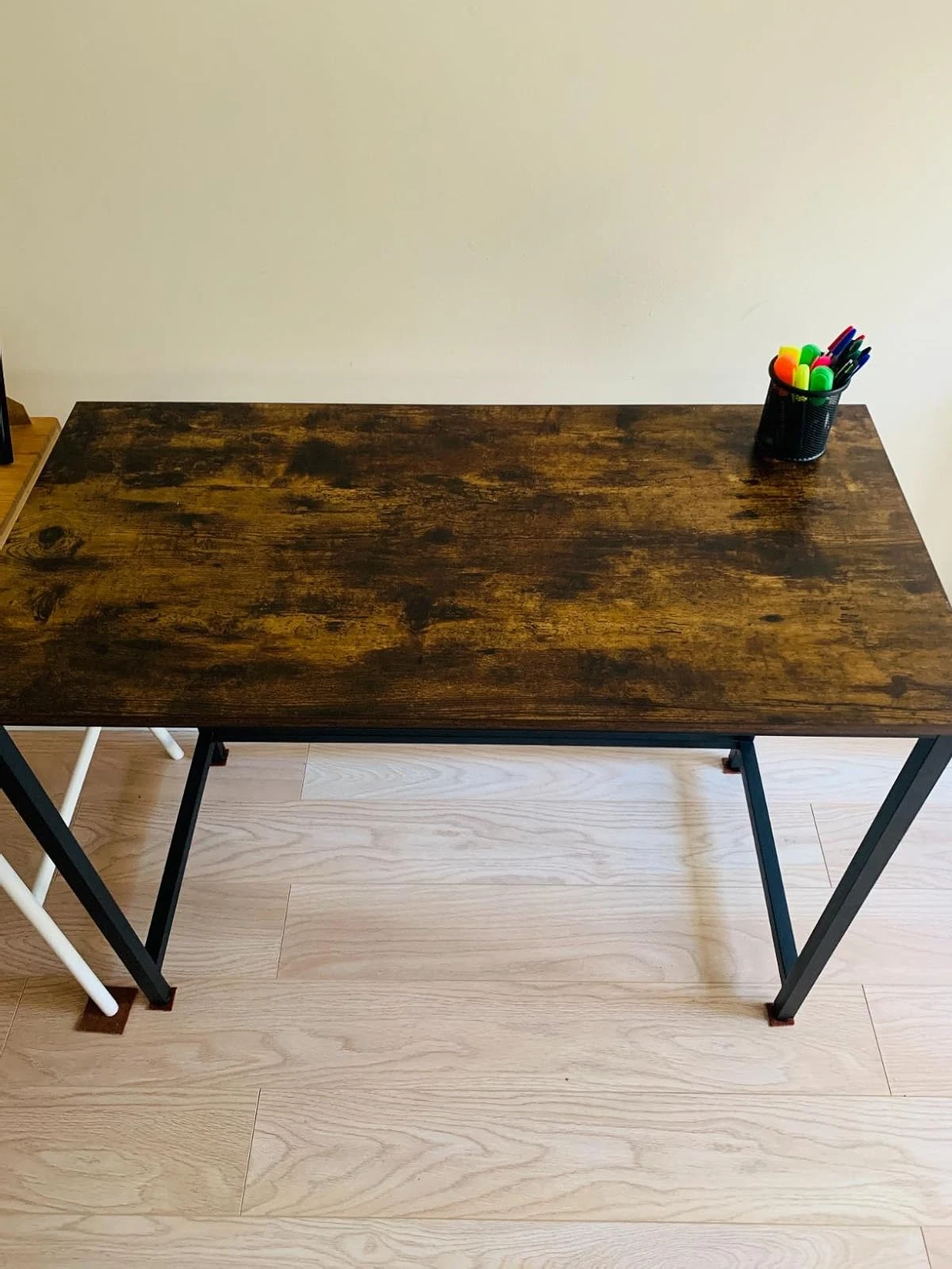 Industrial style study table with dark wood particleboard surface