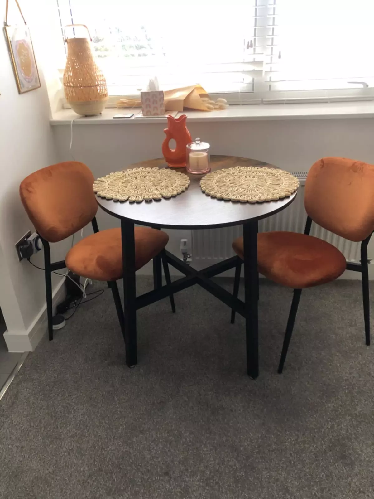 dark wood round shaped top and metal base table