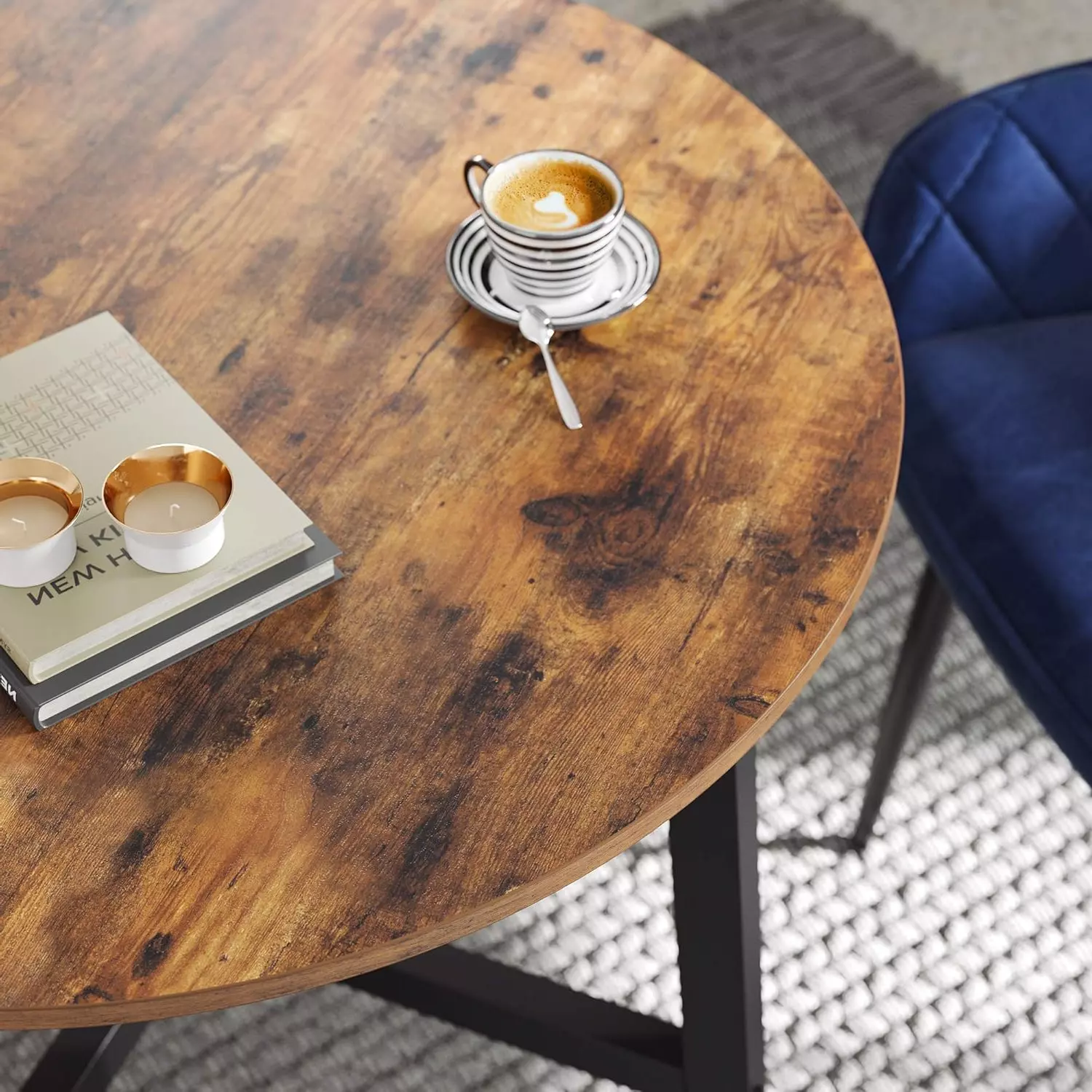 wooden dining table with metal legs in round shape