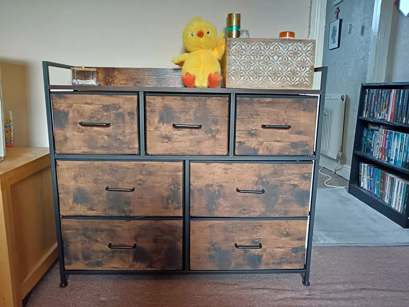 wooden bedroom dresser with 7 drawers in dark wood tone