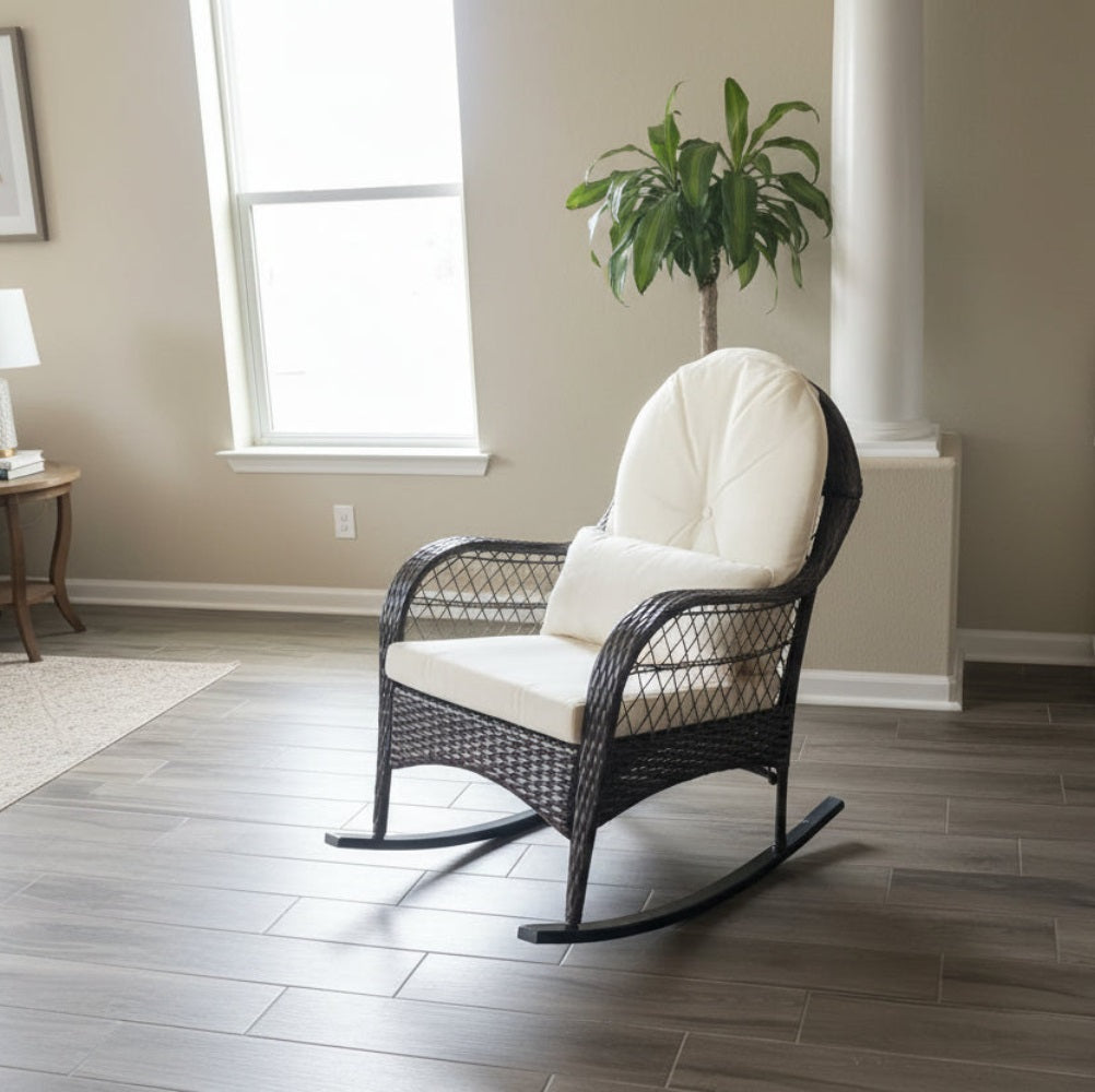 dark brown rattan rocking chair with cream white cushions