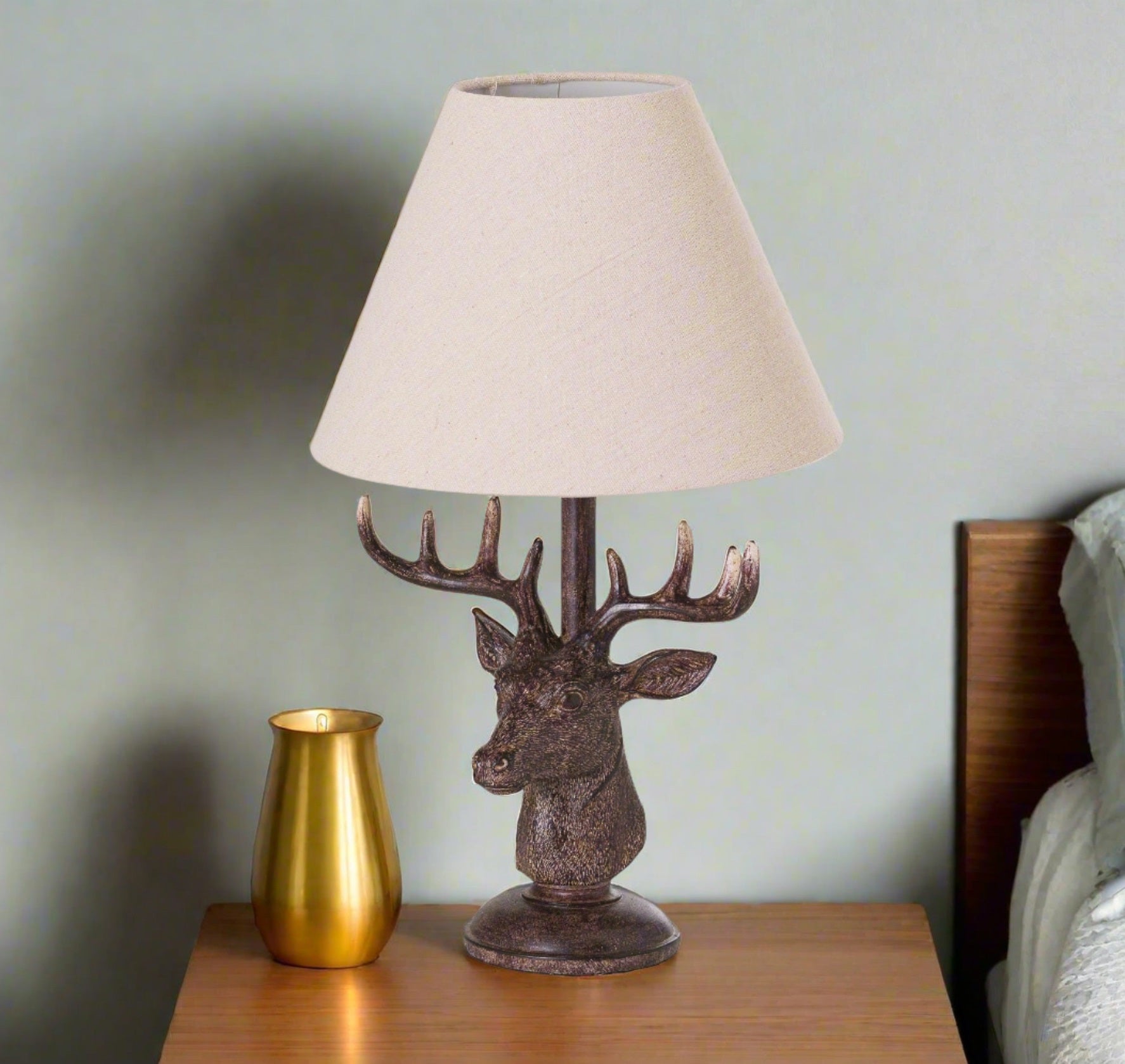 stag head table lamp with linen shade and resin base