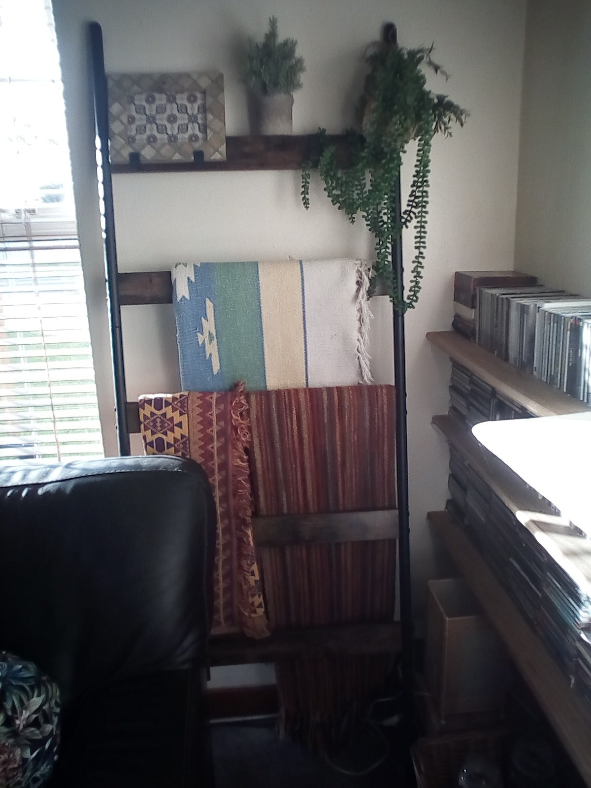 towel storage ladder with wooden rungs and steel frame
