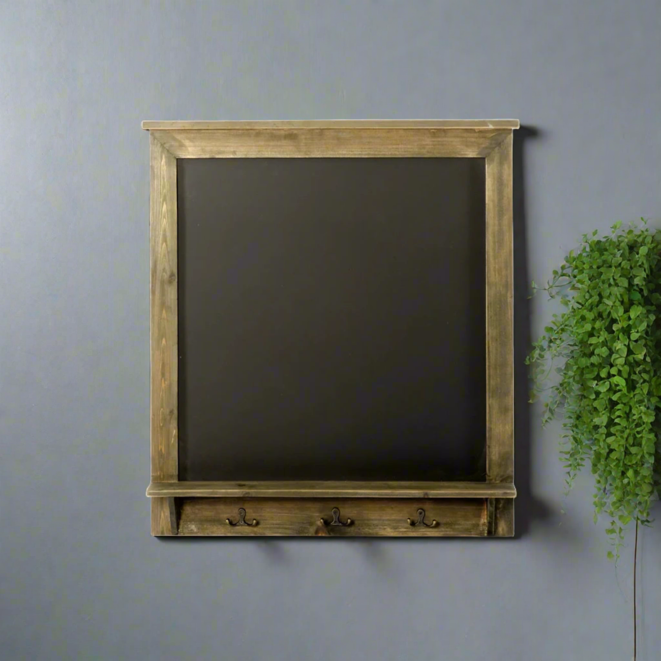 vintage style chalkboard with hooks and shelf
