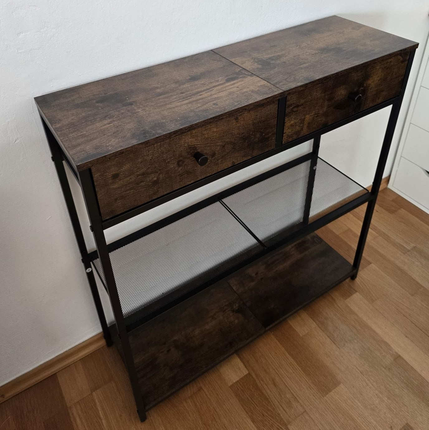 dark wood tone top and black steel base entryway table