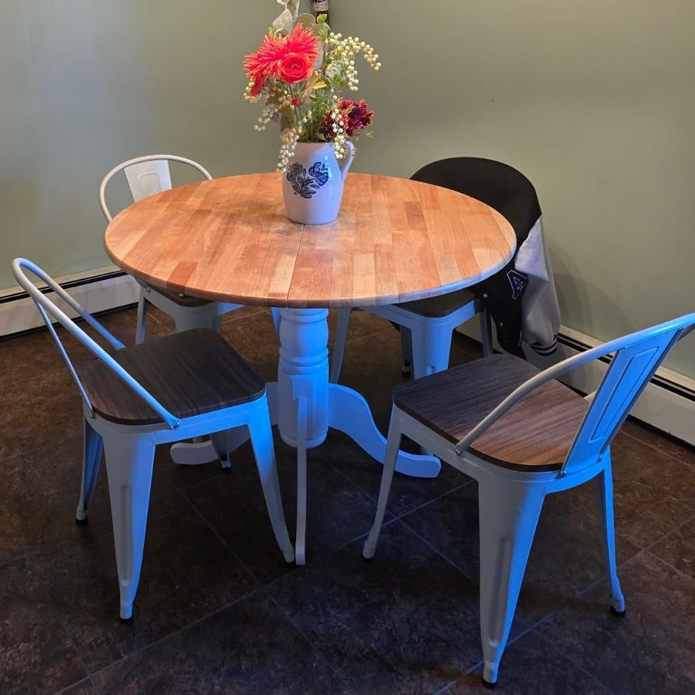 uniquely designed wooden dining table with white base