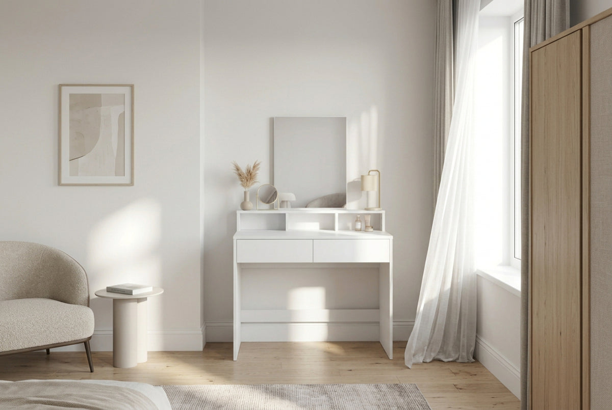 Large clear mirror on a white bedroom dressing table for makeup application