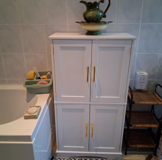 Adjustable wooden shelves inside white kitchen storage cupboard
